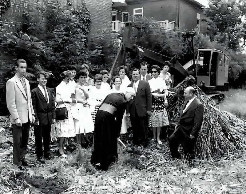 Mgr Labrie surrounded by faithful during a ceremony
